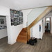 Hall stairs and through to utility room